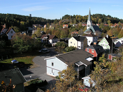 View from above of Valdemarsvik, houses, church, green trees